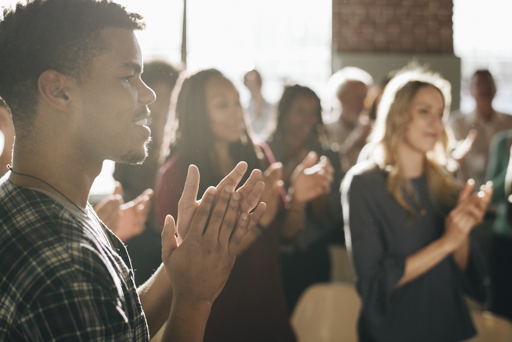 Diverse people clapping after a session