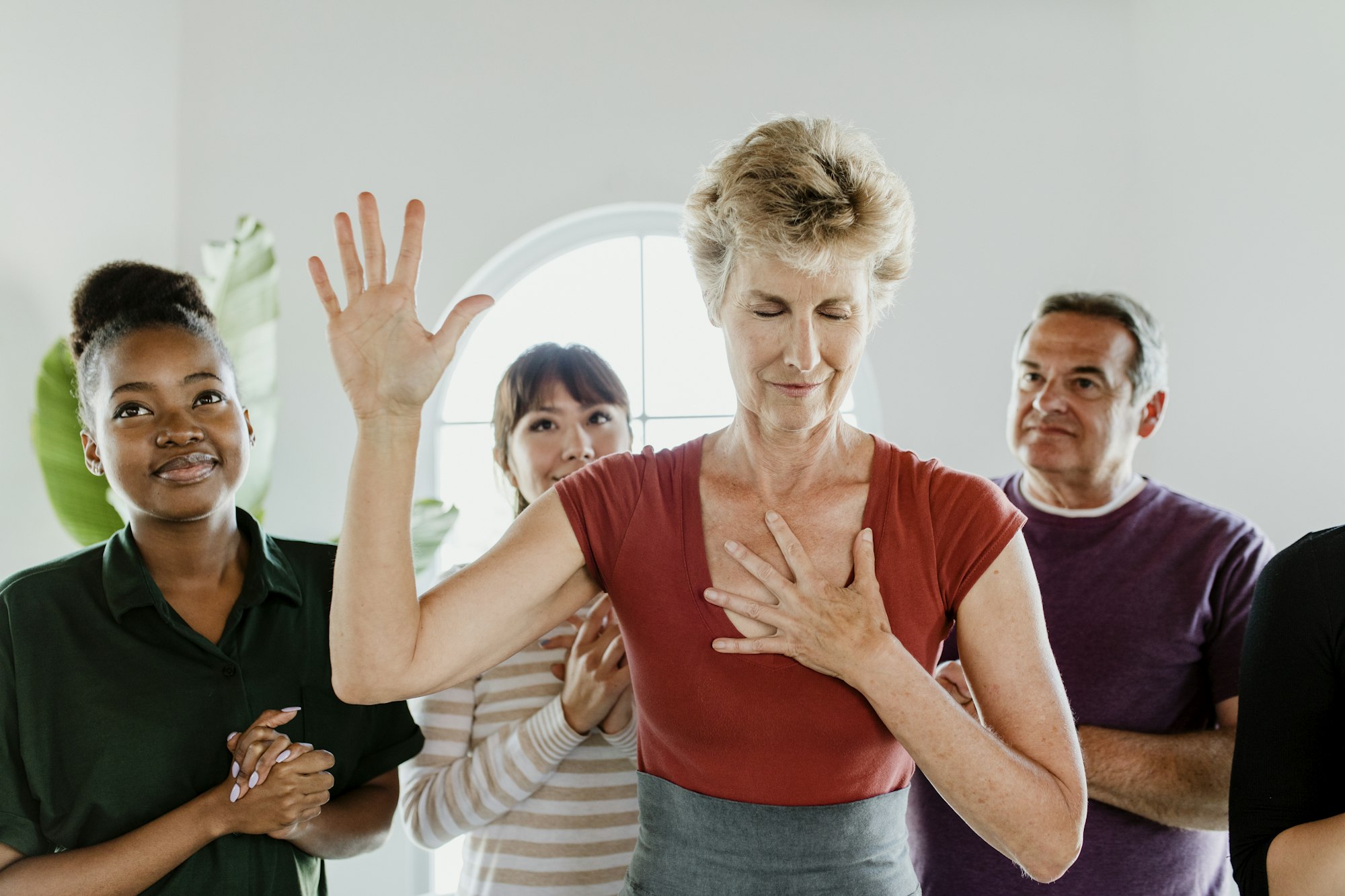 Woman praying in a group